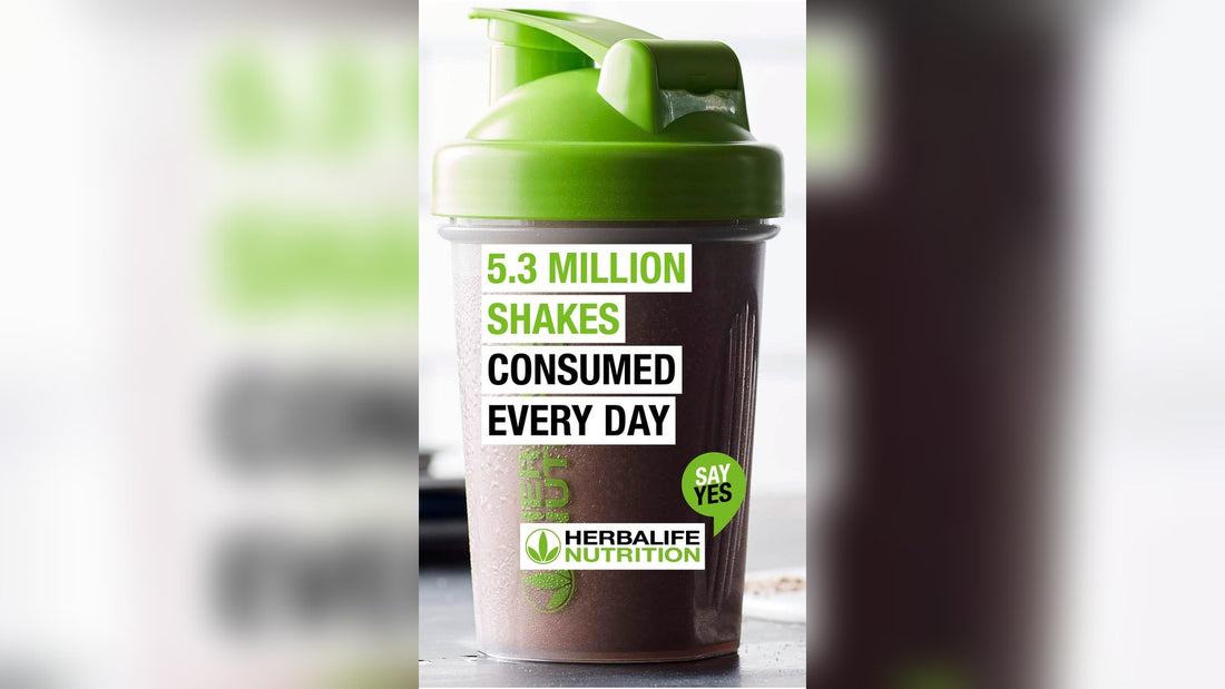A green and black shaker bottle with text promoting daily herbalife protein shake consumption.
